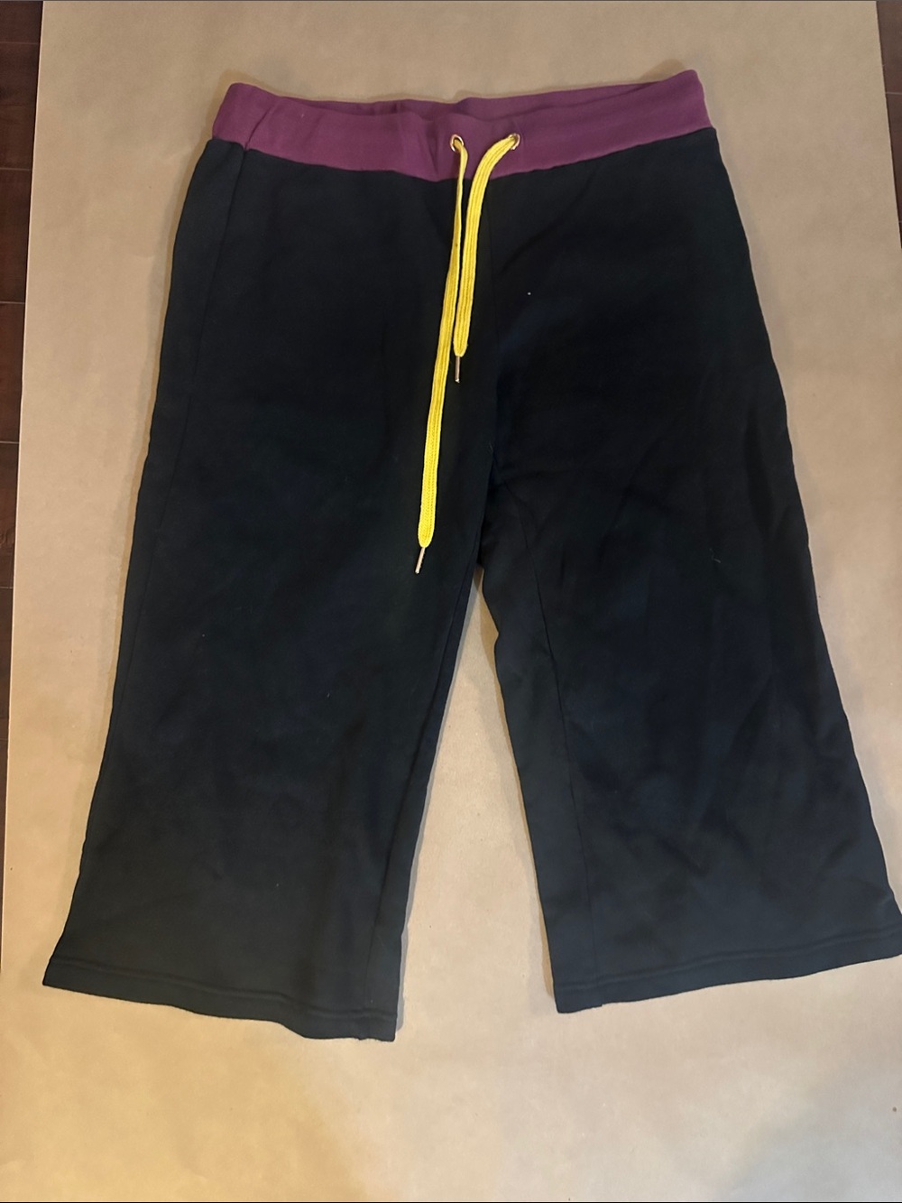 Black Women's Track Jogger Shorts with Purple Waistband and Yellow Drawstring
